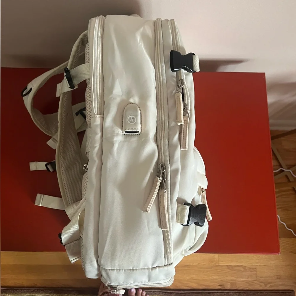 Elegant offwhite Travel carry on Backpack.So many compartments, zippers allwork🌸